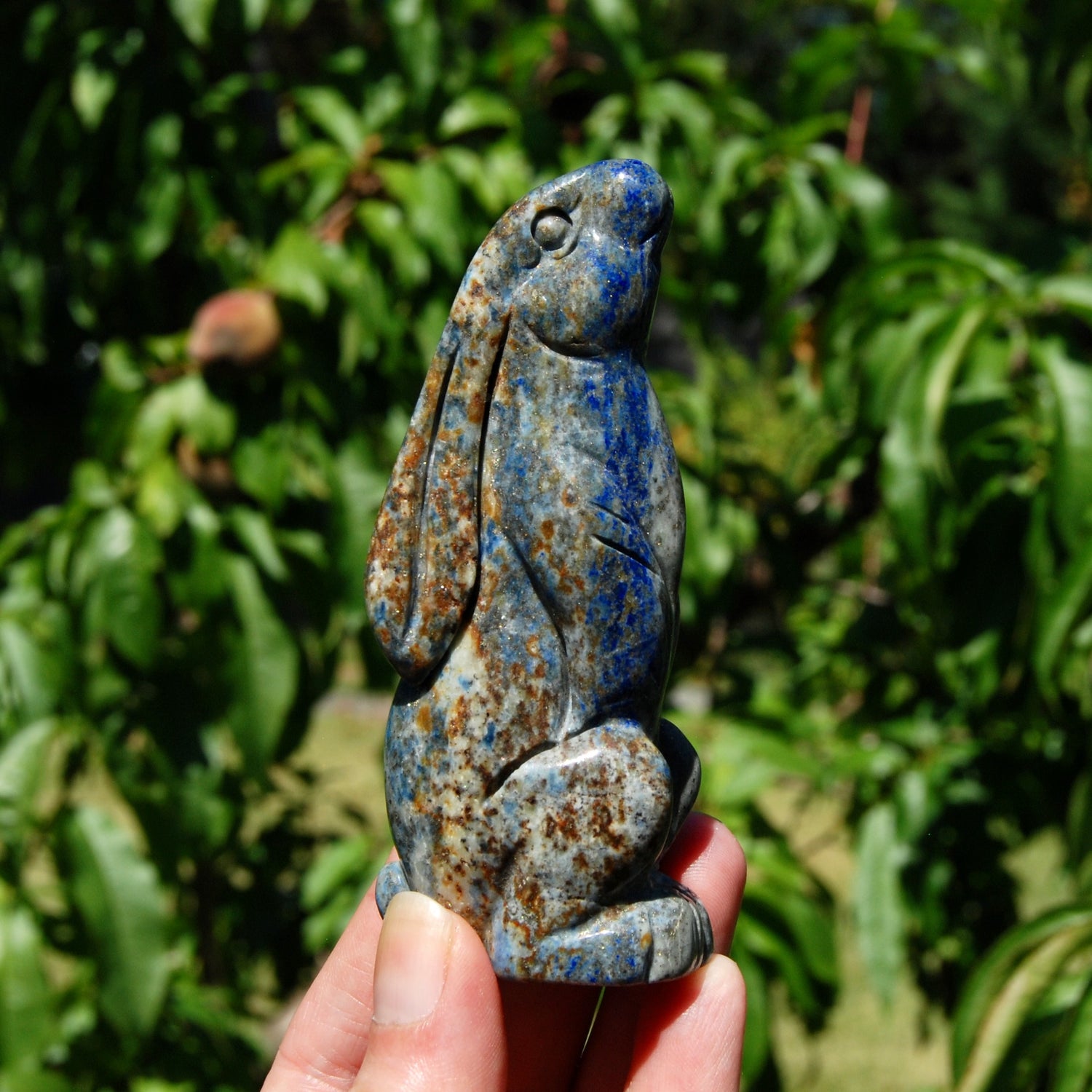Hand-carved Lapis Lazuli crystal rabbit figurine with deep blue gemstone and golden pyrite flecks