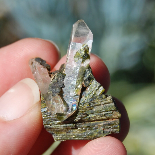 epidote crystal, epidote stone, epidote gemstone, epidote meaning, epidote healing properties, raw epidote, polished epidote, epidote jewelry, epidote cluster, epidote specimen, epidote heart chakra, buy epidote crystal, epidote for sale