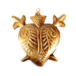 Ornate flaming Sacred Heart milagro with two crossed swords, vintage-style religious decoration