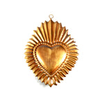 Ornate Sacred Heart of Jesus sunburst milagro featuring radiating rays of Divine light