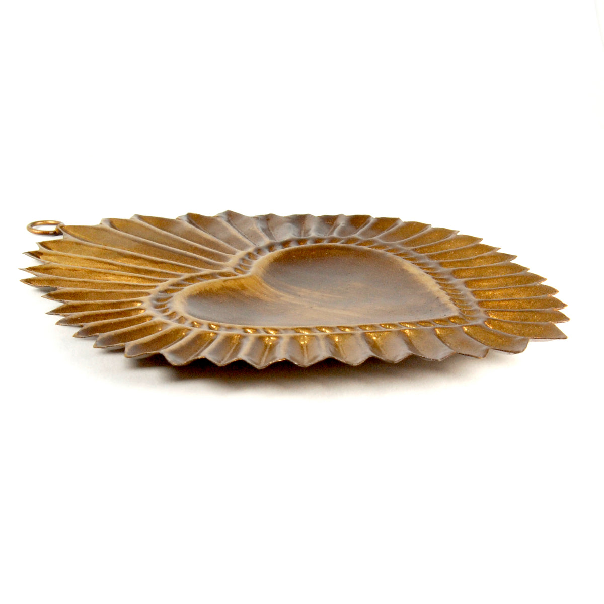 Side view of Sacred Heart sunburst ex voto ornament showing decorative metalwork