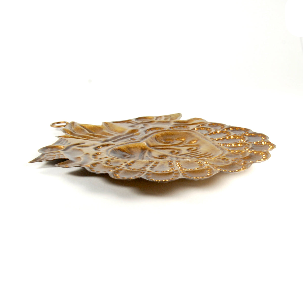 Side view of Sacred Heart ex voto ornament with decorative metalwork and intricate angel detailing