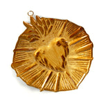 Reverse side of 6in pressed metal Sacred Heart starburst milagro ornament