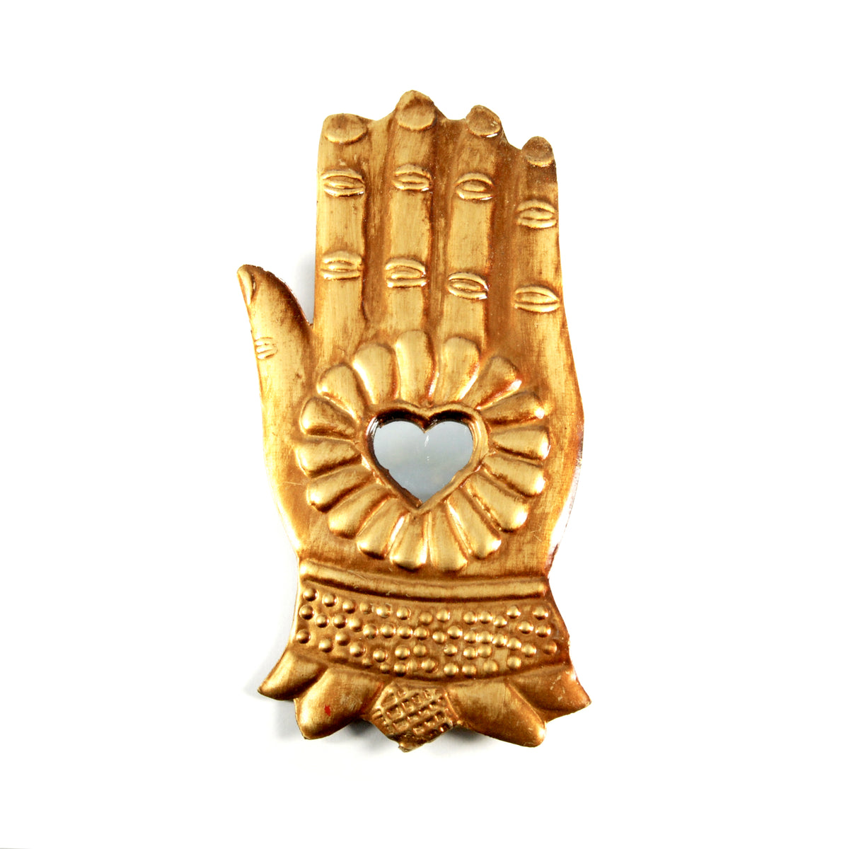 Ornate antiqued gold Divine Hand milagro featuring a heart-shaped mirror surrounded by intricate floral metalwork