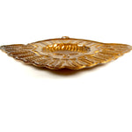 Side view of Winged Seraphim ex voto ornament showing decorative metalwork and distressed gold patina