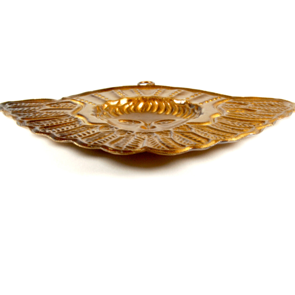 Side view of Winged Seraphim ex voto ornament showing decorative metalwork and distressed gold patina