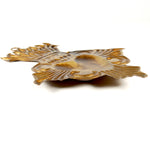 Side view of vintage-style Sacred Heart ex voto milagro ornament showing decorative metalwork