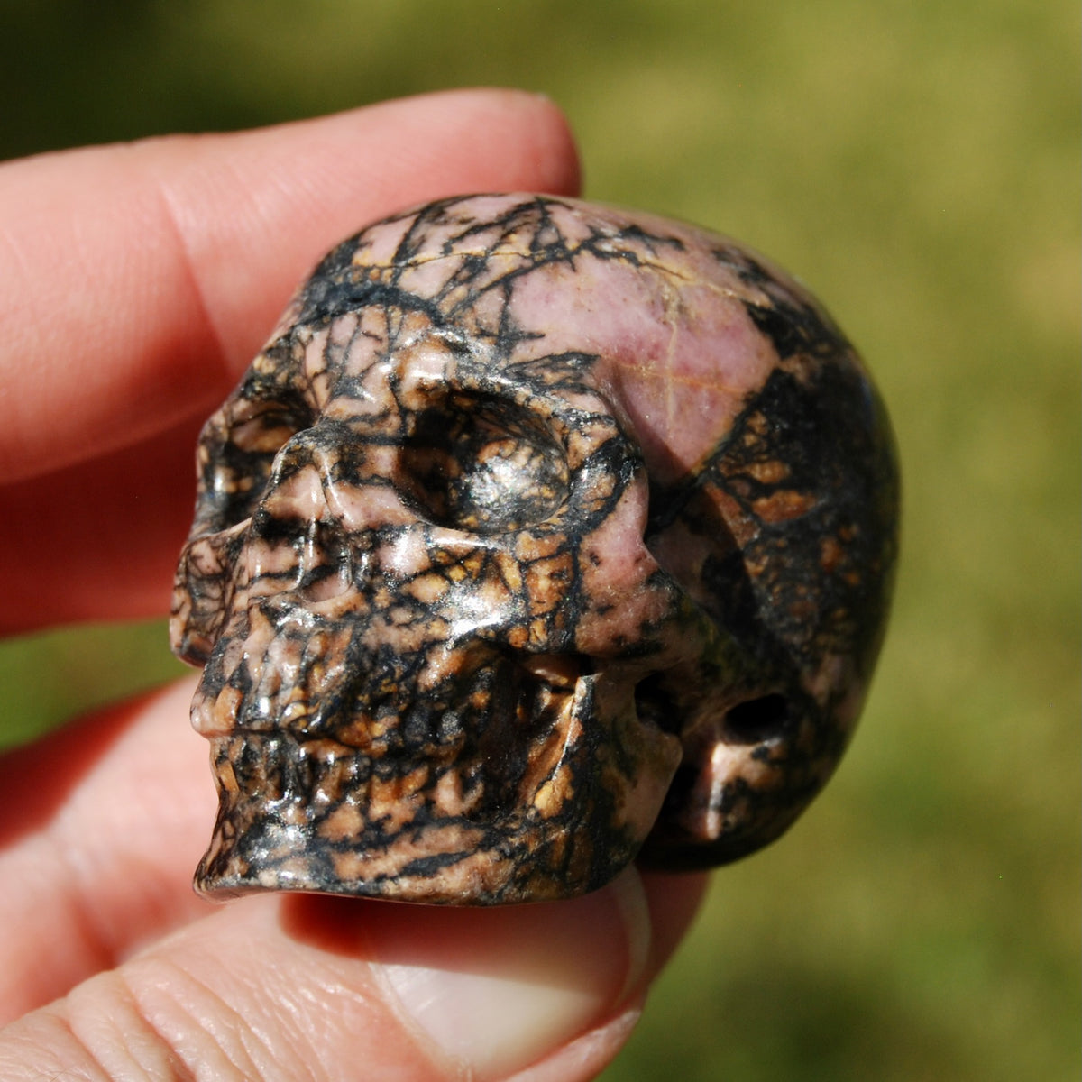 Pink Rhodonite Carved Crystal Skull