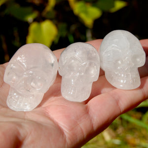 ONE 1.5in Clear Quartz Crystal Skull, Primitive Style Carving