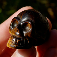 Load image into Gallery viewer, Tiger Eye Carved Crystal Skull 
