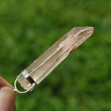 Load image into Gallery viewer, Inner Child Isis Face Pink Lithium Lemurian Seed Crystal Starbrary Pendant
