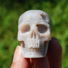 Load image into Gallery viewer, Sakura Flower Agate Carved Crystal Skull
