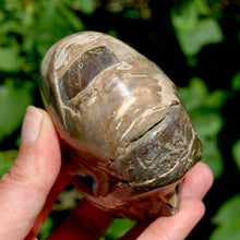 Load image into Gallery viewer, Red Ammonite Hand Carved Crystal Skull
