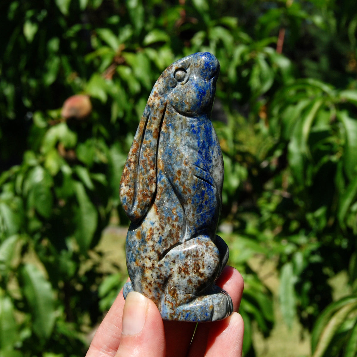 Hand-carved Lapis Lazuli crystal rabbit figurine with deep blue gemstone and golden pyrite flecks