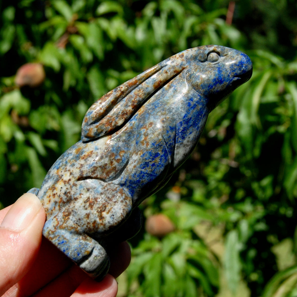 Hand-carved Lapis Lazuli crystal rabbit figurine with deep blue gemstone and golden pyrite flecks