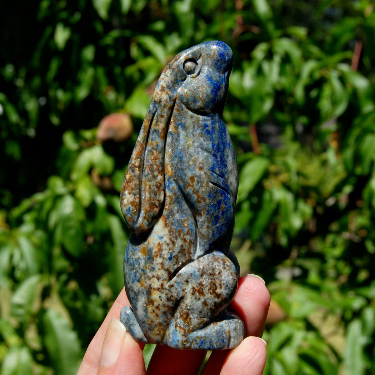 Hand-carved Lapis Lazuli crystal rabbit figurine with deep blue gemstone and golden pyrite flecks