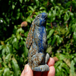 Hand-carved Lapis Lazuli crystal rabbit figurine with deep blue gemstone and golden pyrite flecks