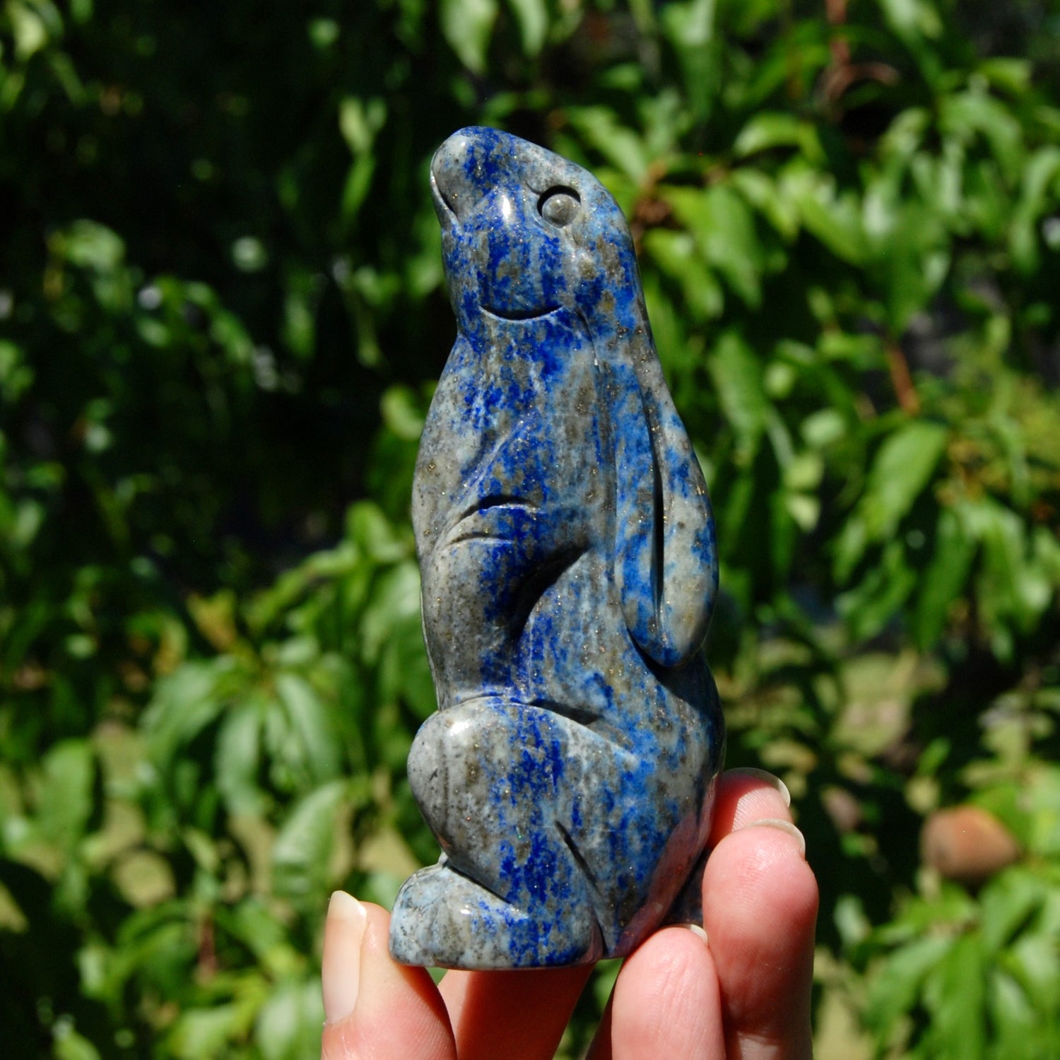 Hand-carved Lapis Lazuli crystal rabbit figurine with deep blue gemstone and golden pyrite flecks