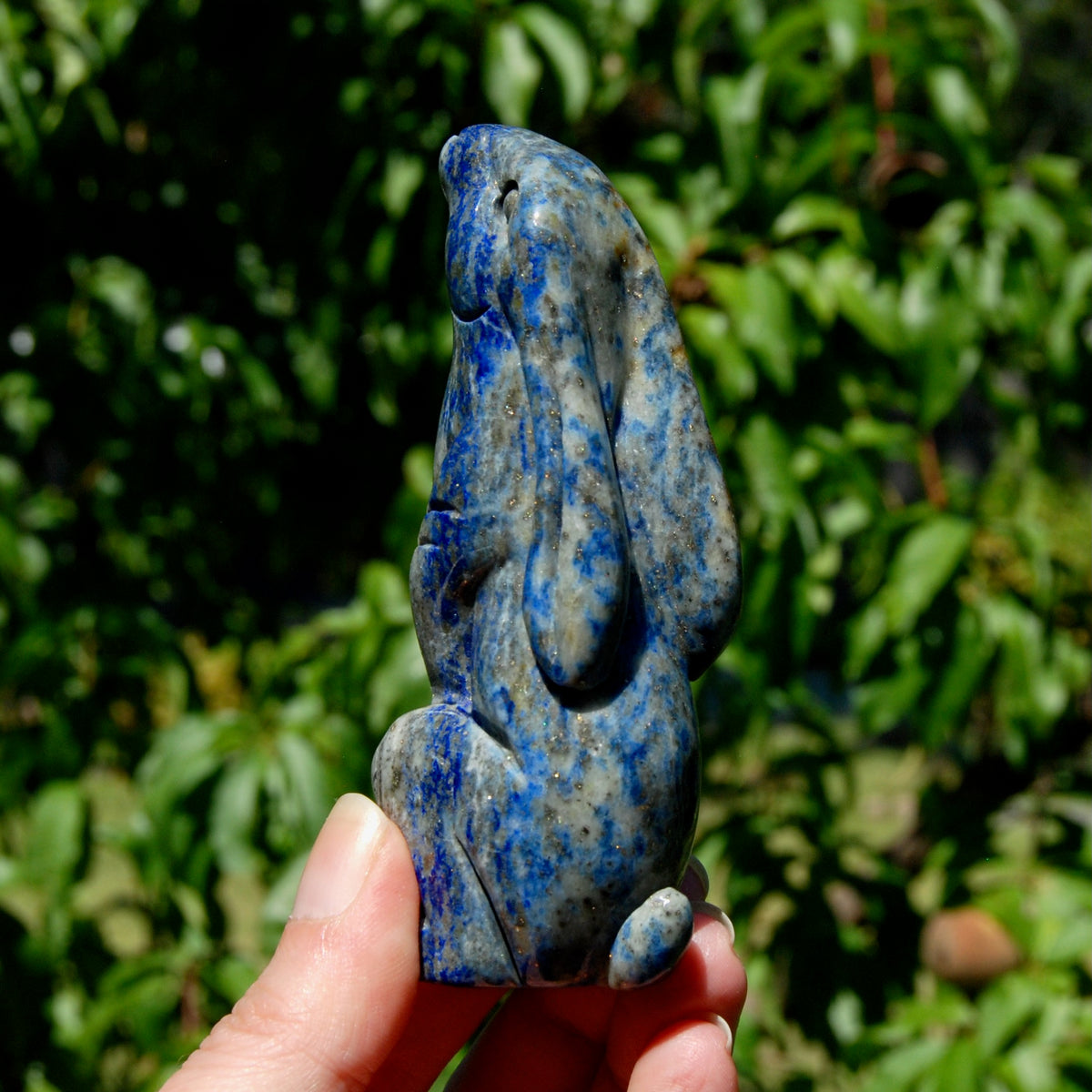 Hand-carved Lapis Lazuli crystal rabbit figurine with deep blue gemstone and golden pyrite flecks