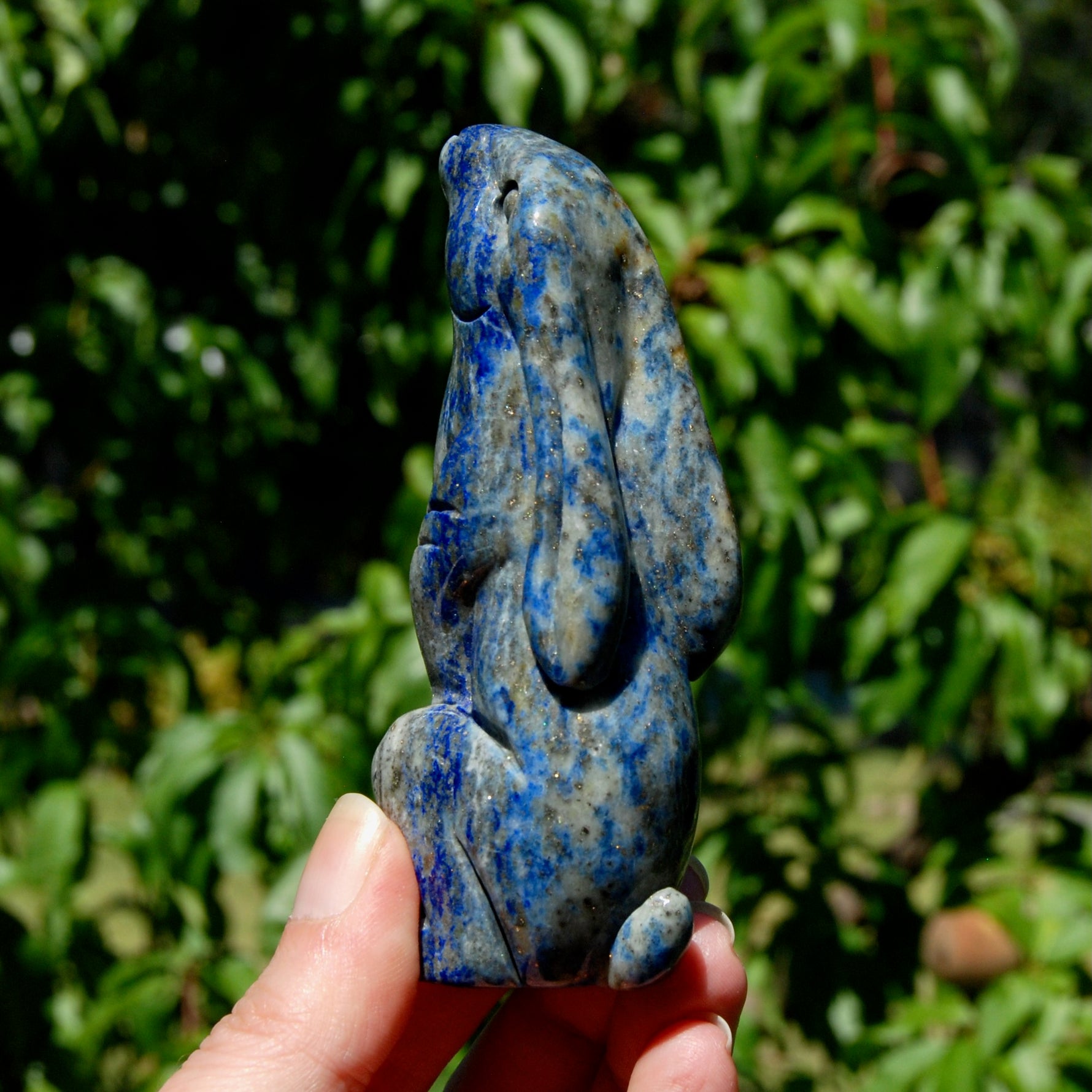Hand-carved Lapis Lazuli crystal rabbit figurine with deep blue gemstone and golden pyrite flecks