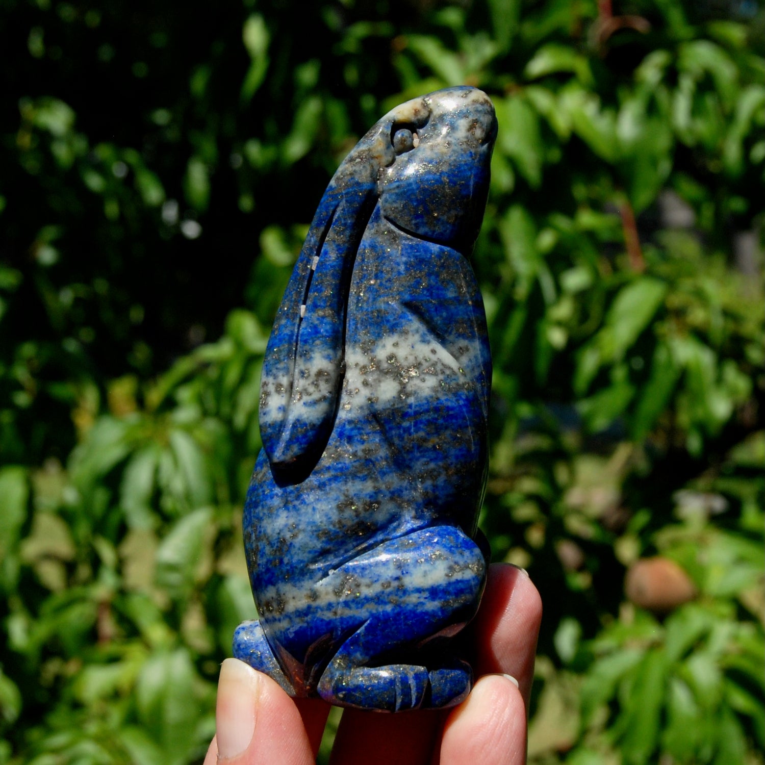 Hand-carved Lapis Lazuli crystal rabbit figurine with deep blue gemstone and golden pyrite flecks