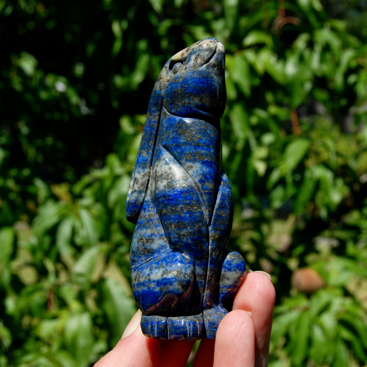 Hand-carved Lapis Lazuli crystal rabbit figurine with deep blue gemstone and golden pyrite flecks