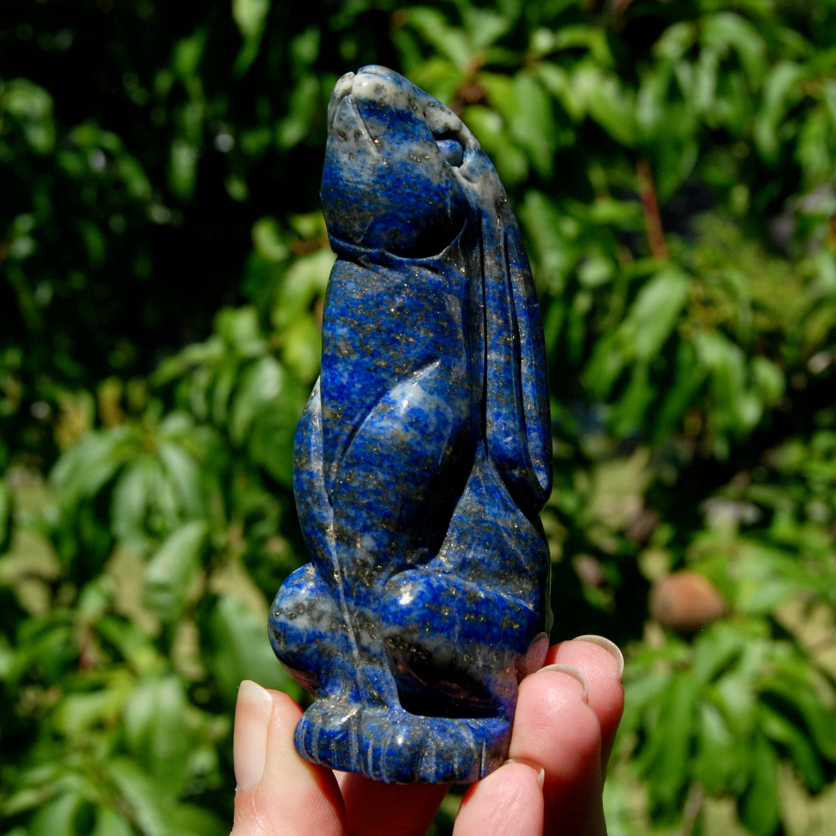 Hand-carved Lapis Lazuli crystal rabbit figurine with deep blue gemstone and golden pyrite flecks