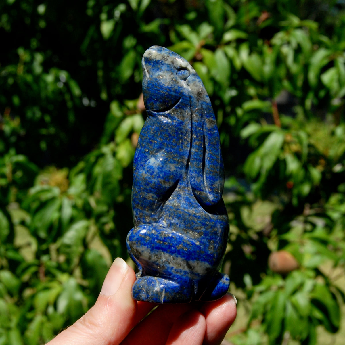 Hand-carved Lapis Lazuli crystal rabbit figurine with deep blue gemstone and golden pyrite flecks