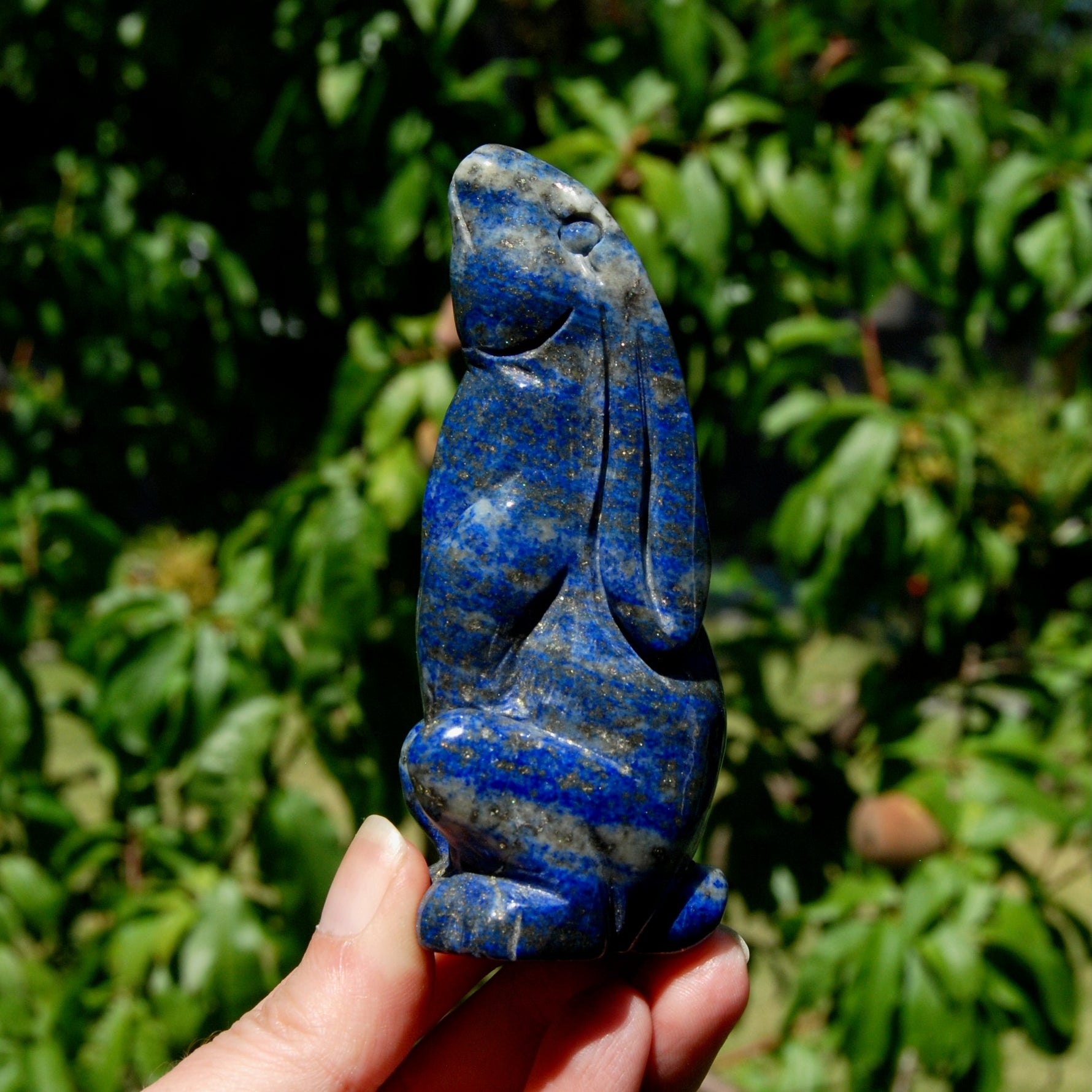 Hand-carved Lapis Lazuli crystal rabbit figurine with deep blue gemstone and golden pyrite flecks