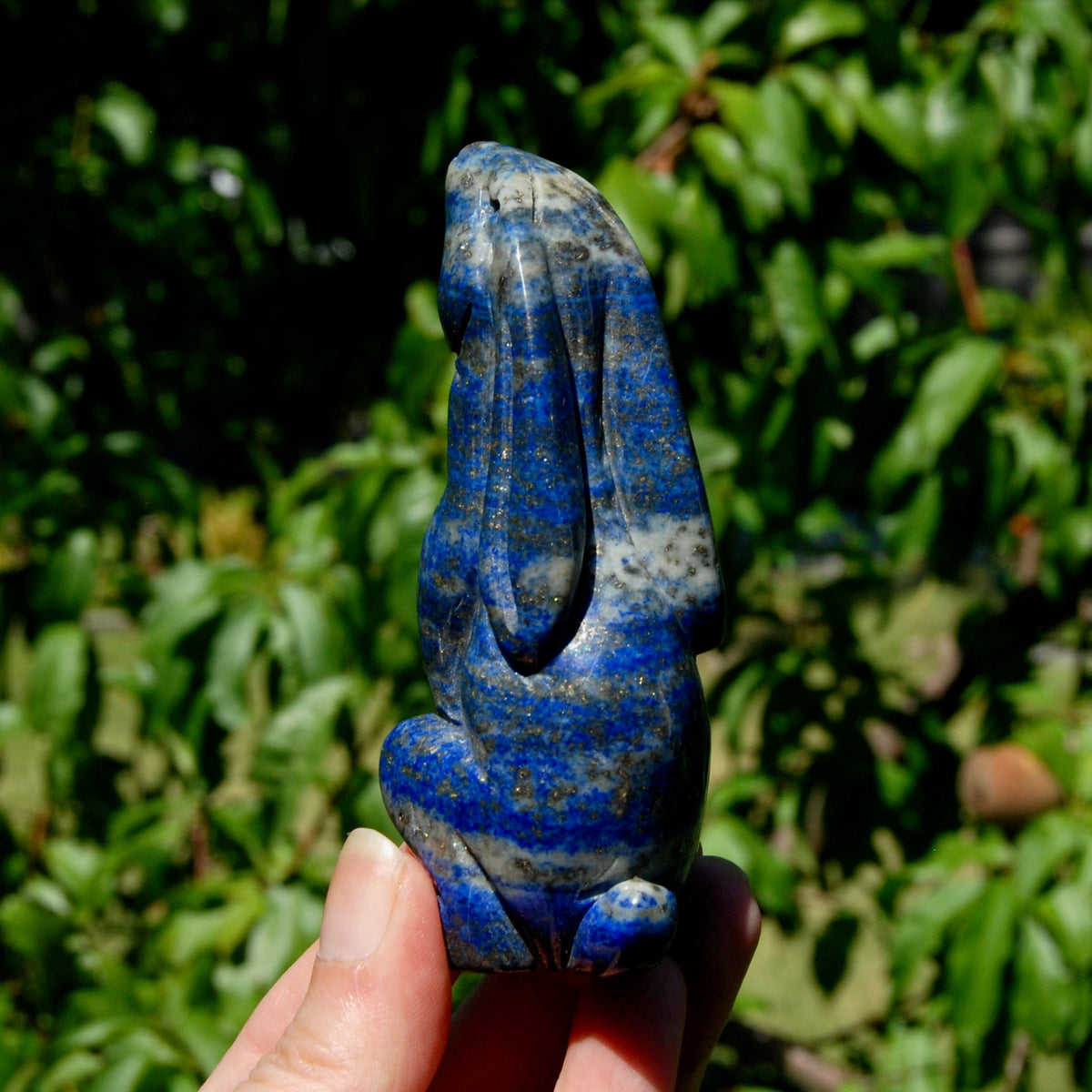 Hand-carved Lapis Lazuli crystal rabbit figurine with deep blue gemstone and golden pyrite flecks