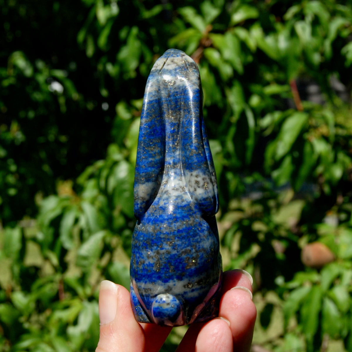 Hand-carved Lapis Lazuli crystal rabbit figurine with deep blue gemstone and golden pyrite flecks