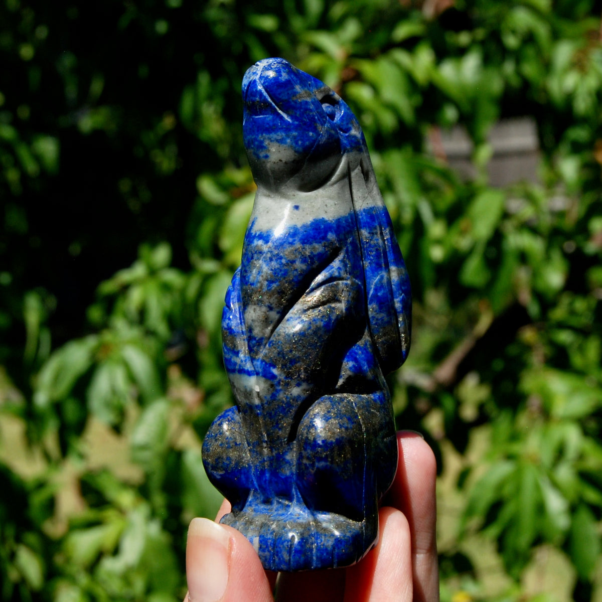 Hand-carved Lapis Lazuli crystal rabbit figurine with deep blue gemstone and golden pyrite flecks