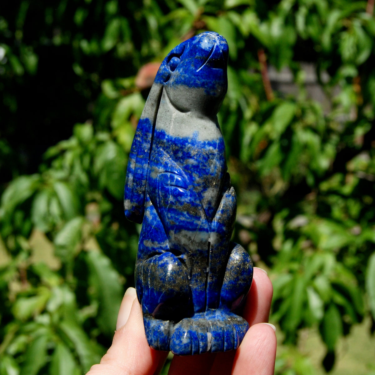 Hand-carved Lapis Lazuli crystal rabbit figurine with deep blue gemstone and golden pyrite flecks