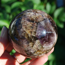 Load image into Gallery viewer, Super Seven Cacoxenite Amethyst Crystal Sphere
